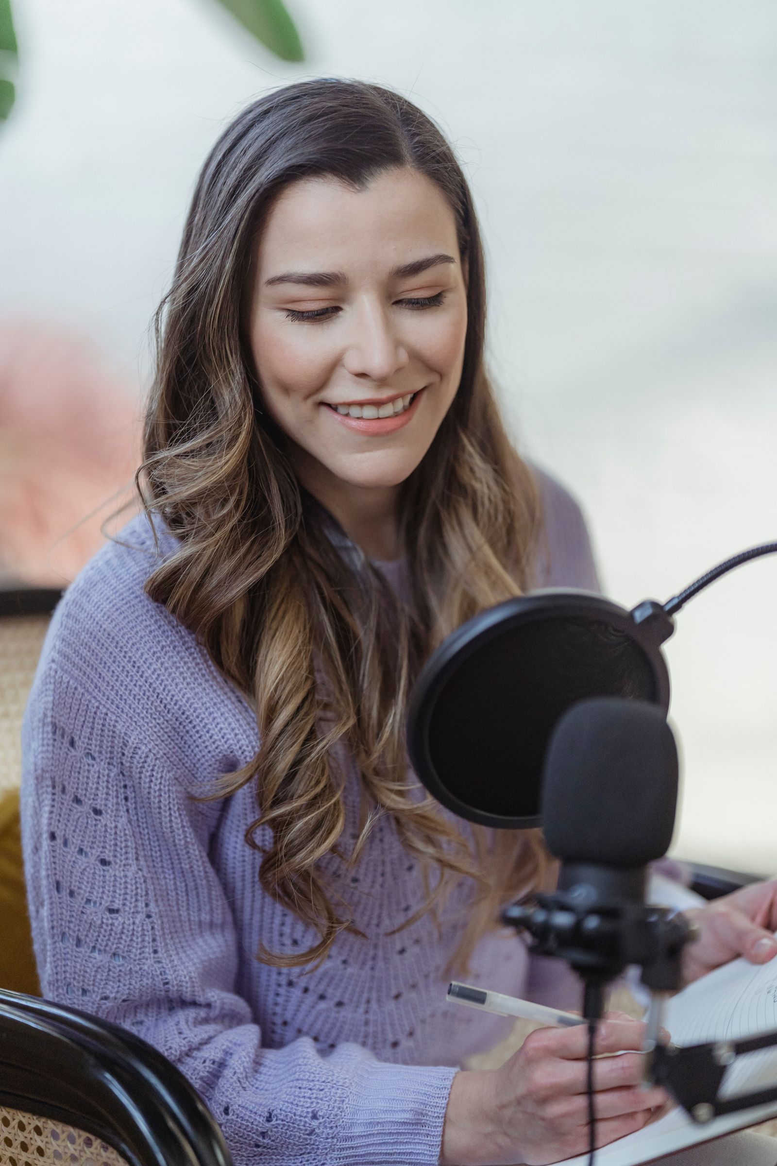 Producer at the mixing board preparing a podcast episode for release