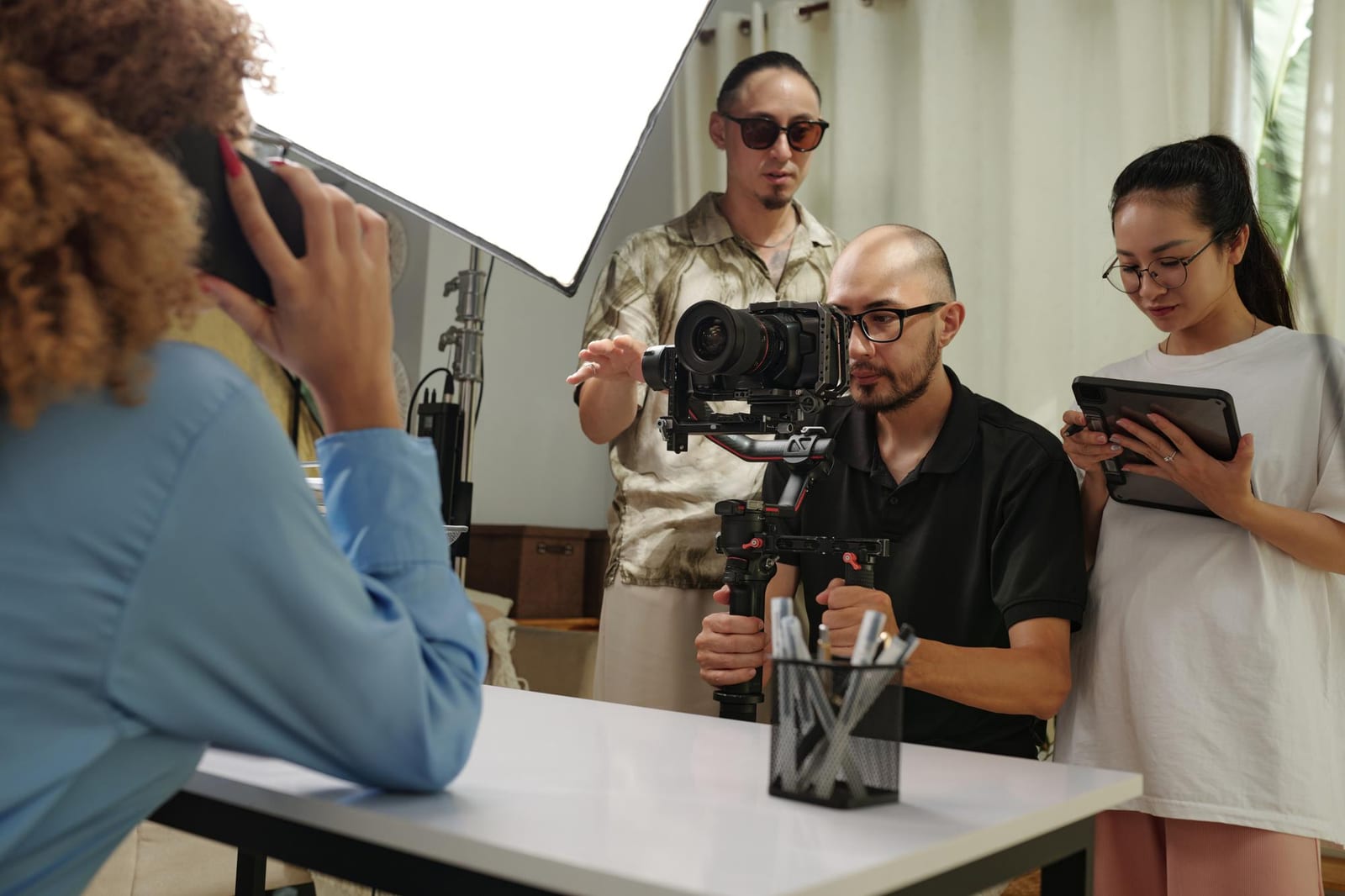 Camera operator filming a subject for a Quillwick feature story